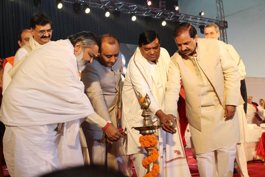 Brahmachari Girish Ji, Shri Sudhanshu Trivedi Ji, Shri Ajay Prakash Shrivastava Ji and Dr. Dr. Mahesh Sharma Ji lighting the lamp.